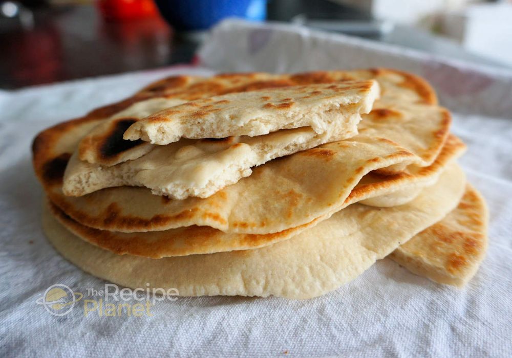 Keep the cooked flatbreads covered with a towel to stay soft. Keep the cooked flatbreads covered with a towel to stay soft.n
