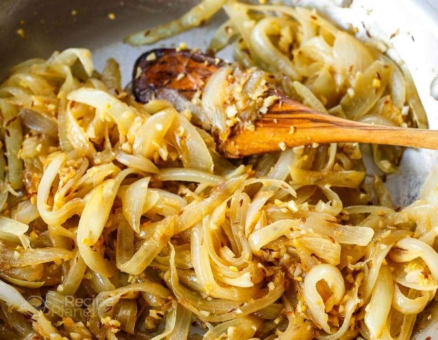 Fry sliced onions until golden brown. Fry sliced onions until golden brown.